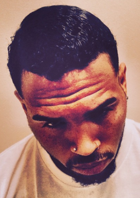 MXM UPDATE: Chris Brown shows off new look, dyes hair jet black 